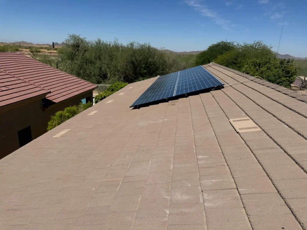 [Completed tile roof replacement, wide exterior shot]