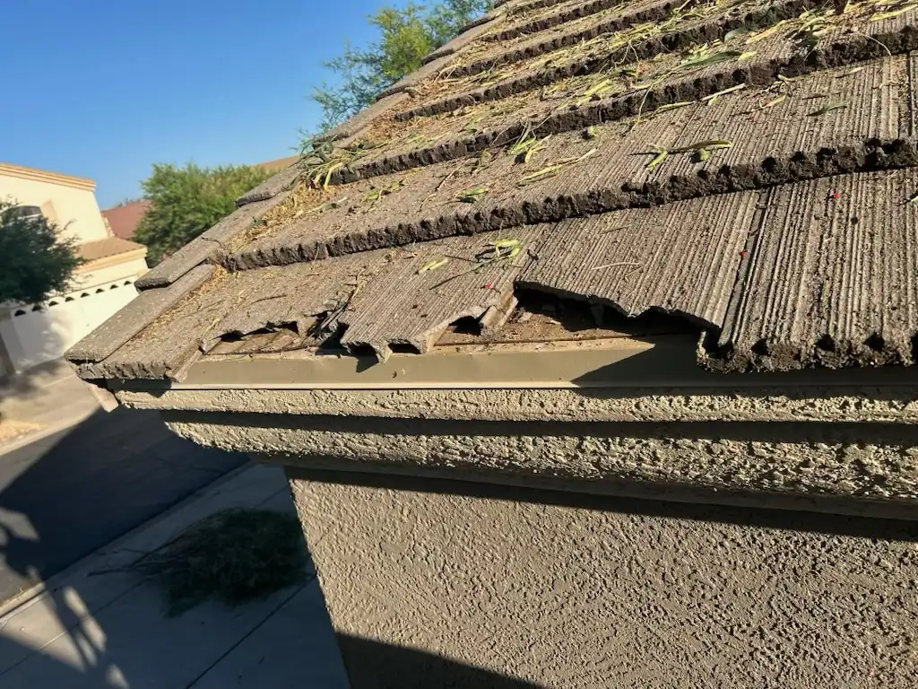 Broken and cracked concrete roof tiles on a Phoenix tile roof